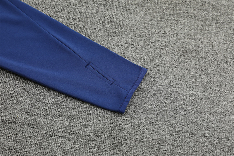 Buzo Completo Manchester United Naranja Azul