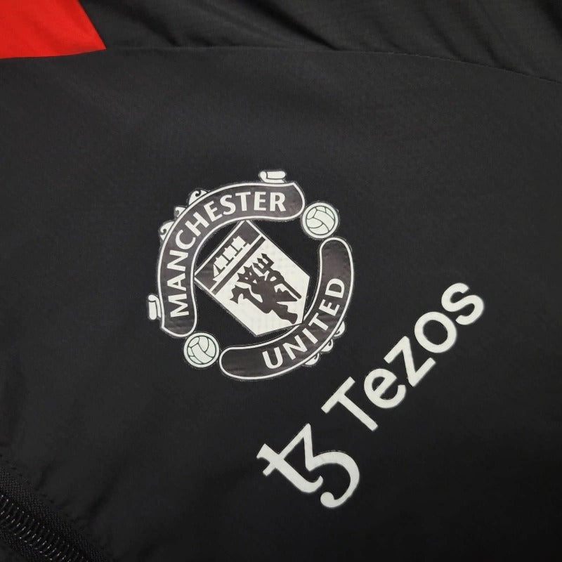 Cortavientos Manchester United Negro/Rojo 2023/24
