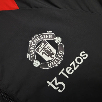 Cortavientos Manchester United Negro/Rojo 2023/24